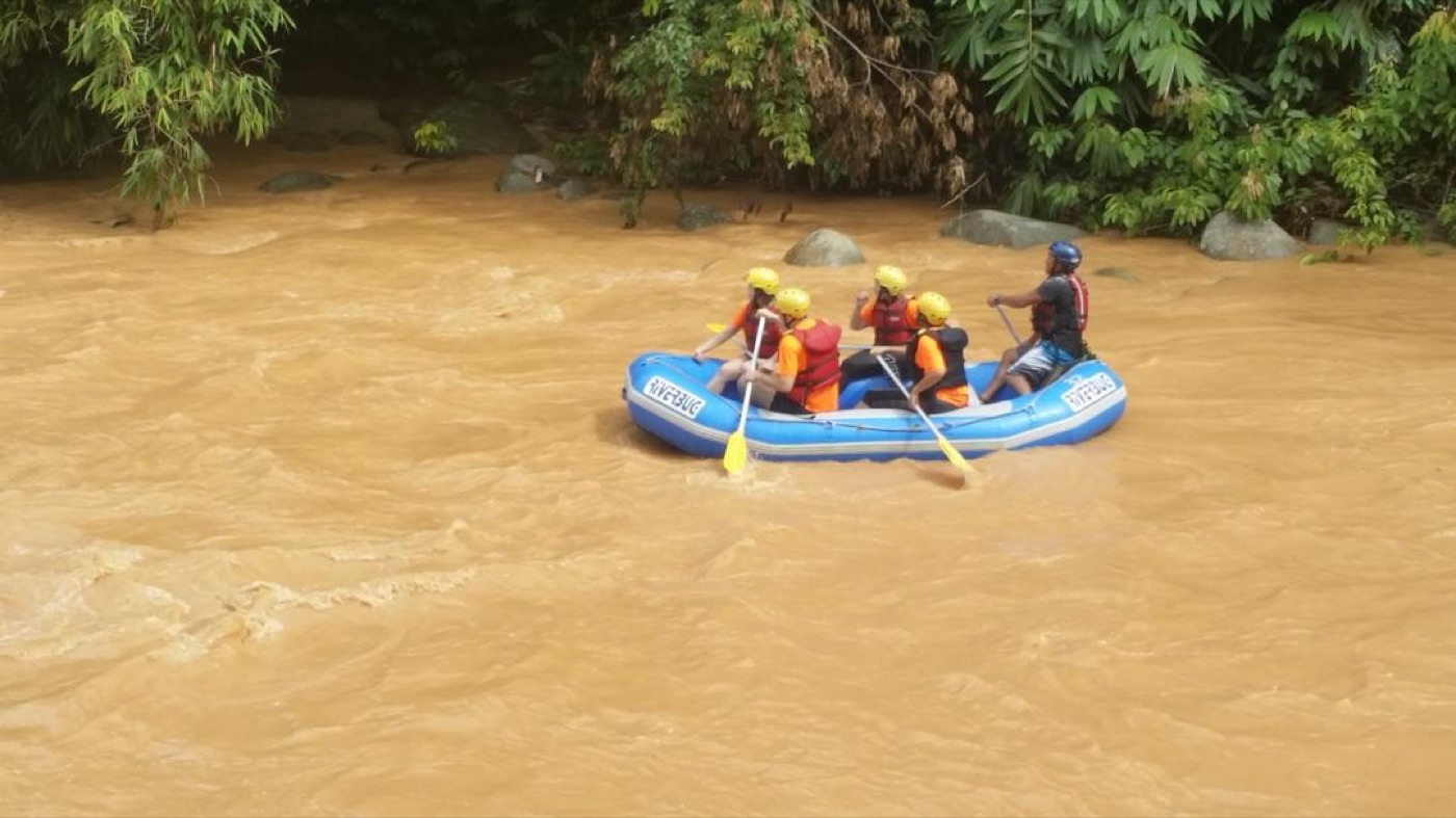 Team white water rafting on Sungai Kampar river in Gopeng Perak during corporate adventure program