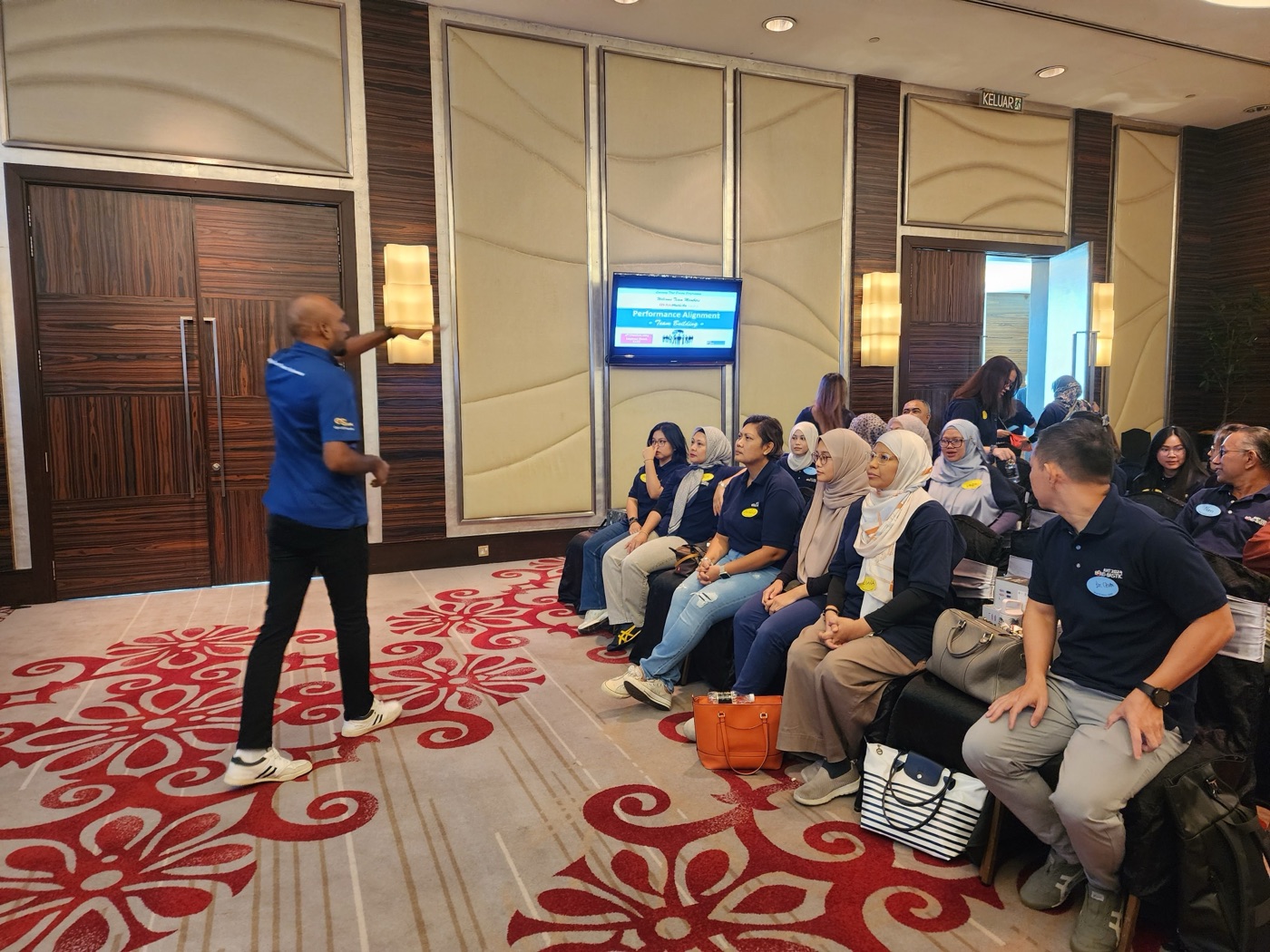 Corporate training event in Malaysia showing diverse group of professionals